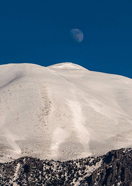 Moon over the snow covered Psiloritis summit